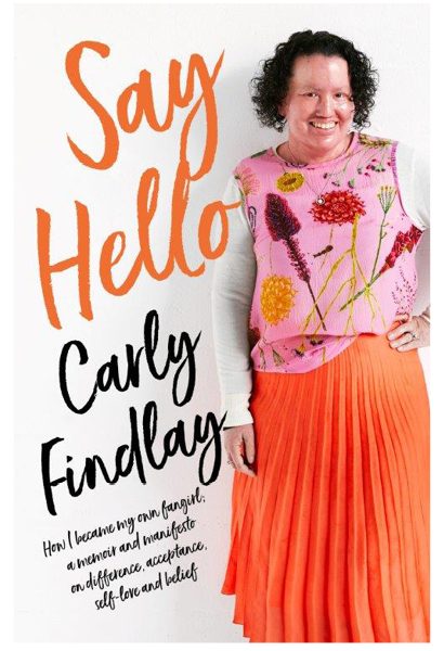 Book cover of 'Say Hello'. Cover is white, with the title in big orange font. The author, Carly Findlay, stands smiling on the right hand side of the cover.