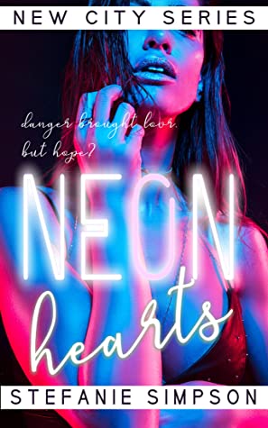 Book Cover of 'Neon Hearts'. A picture of a woman drenched in blue and red neon light. The book title is in white over the top, the word 'Neon' is made out of glowing light tubes.